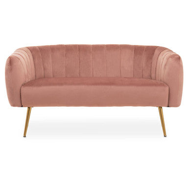 Pink velvet sofa with gold legs on a white background