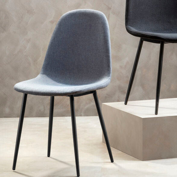 Two modern chairs, one gray and one black, on a neutral background.