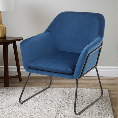 Blue armchair with black metal legs in a room setting