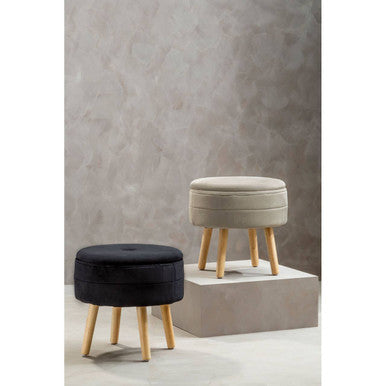 Two round stools with black and beige cushions on a neutral background