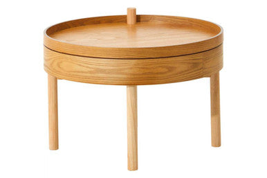 Wooden round side table with a tray on a white background