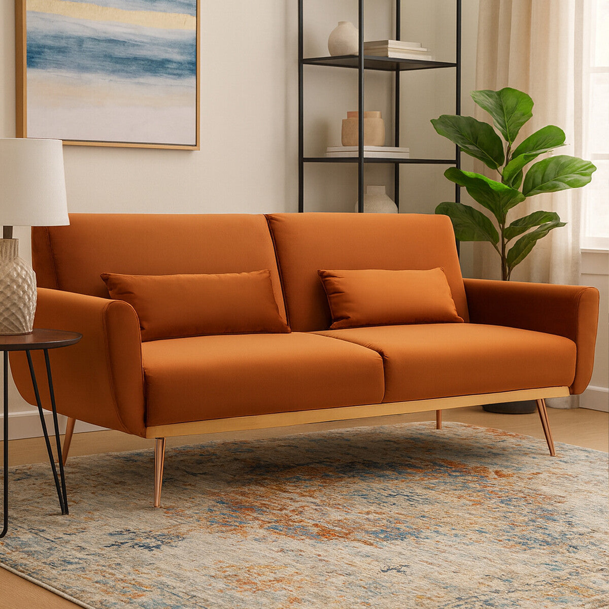 Orange sofa in a living room with a rug, side table, and decorative items.