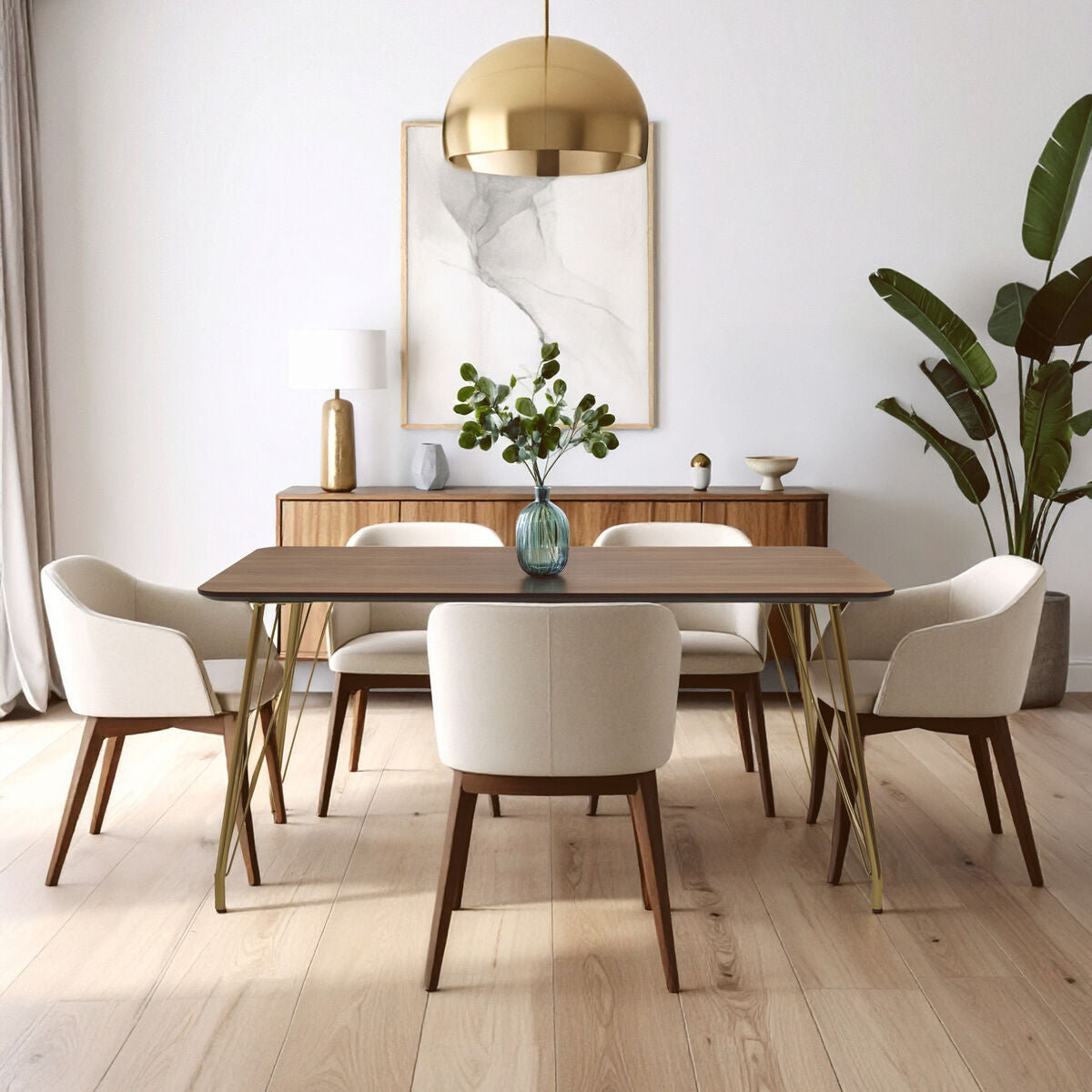 Dining room with wooden table and white chairs, gold pendant light, and plants.