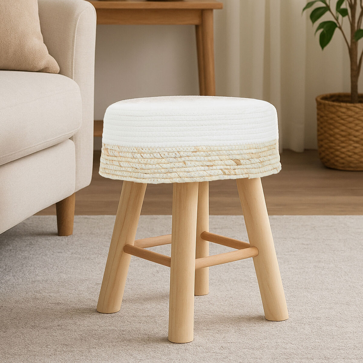 Small stool with woven top and wooden legs in a living room setting