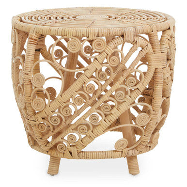 Woven rattan side table with intricate patterns on a white background
