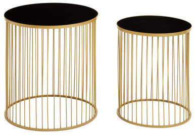 Two gold wire side tables with black tops on a white background