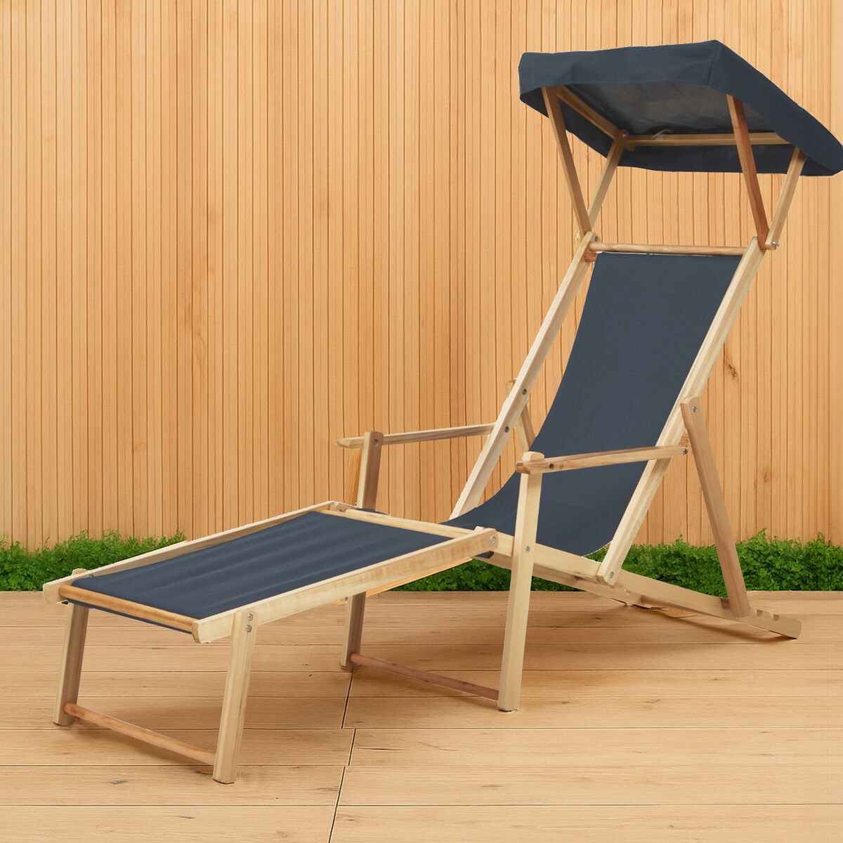Wooden beach chair with blue fabric on a wooden deck