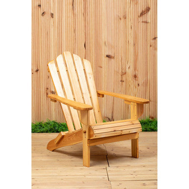 Wooden Adirondack chair on a wooden deck with a wooden fence background