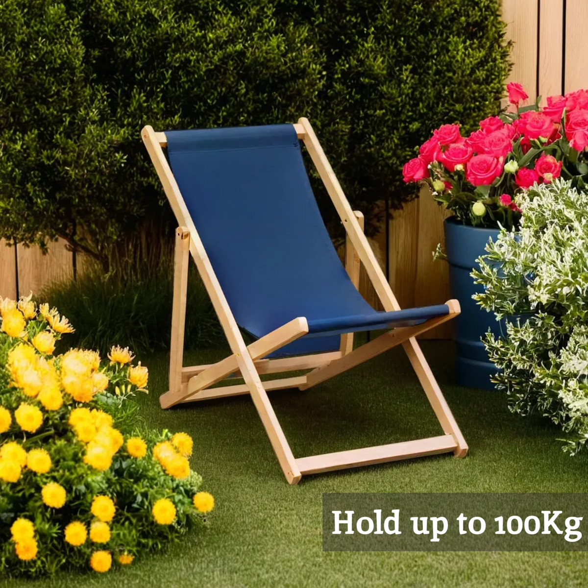 Blue deck chair on grass with flowers and plants around