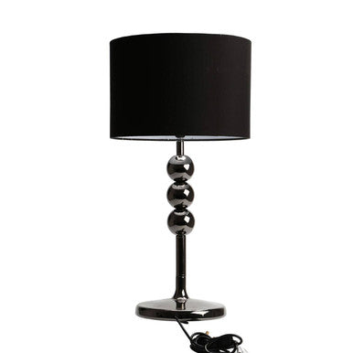 Black table lamp with a chrome base on a white background