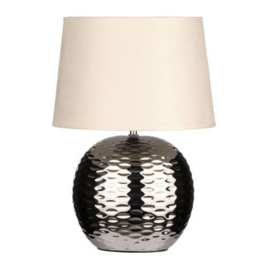 Table lamp with textured metallic base and beige lampshade on a white background