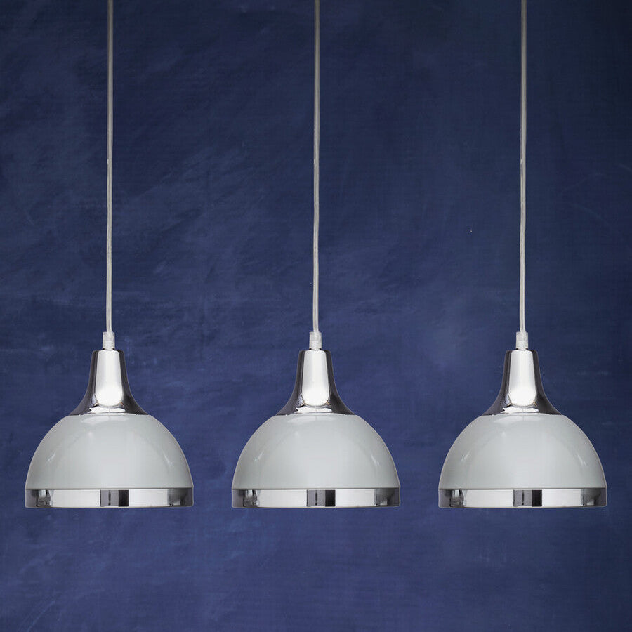 Three pendant lights hanging against a blue background