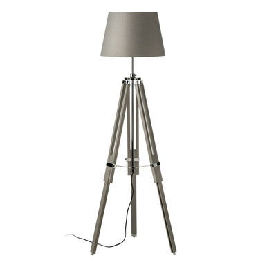 Tripod floor lamp with a gray shade on a white background