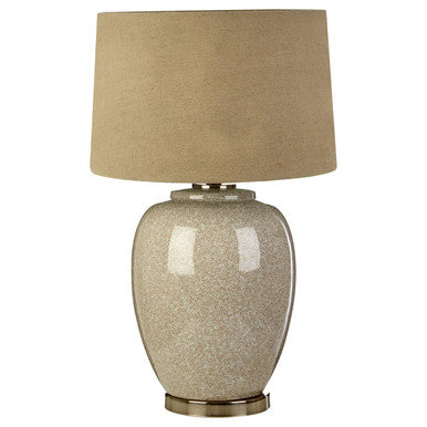 Table lamp with beige textured base and beige lampshade on a white background