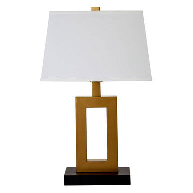Table lamp with gold base, black accent, and white shade on a white background