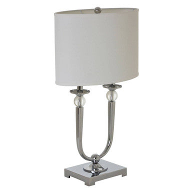 Table lamp with a silver base and white shade on a white background