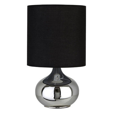 Table lamp with black shade and silver base on a white background