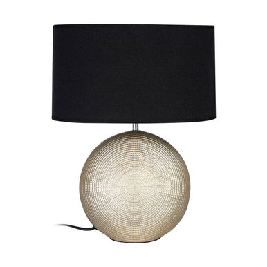 Table lamp with black shade and round beige base on a white background