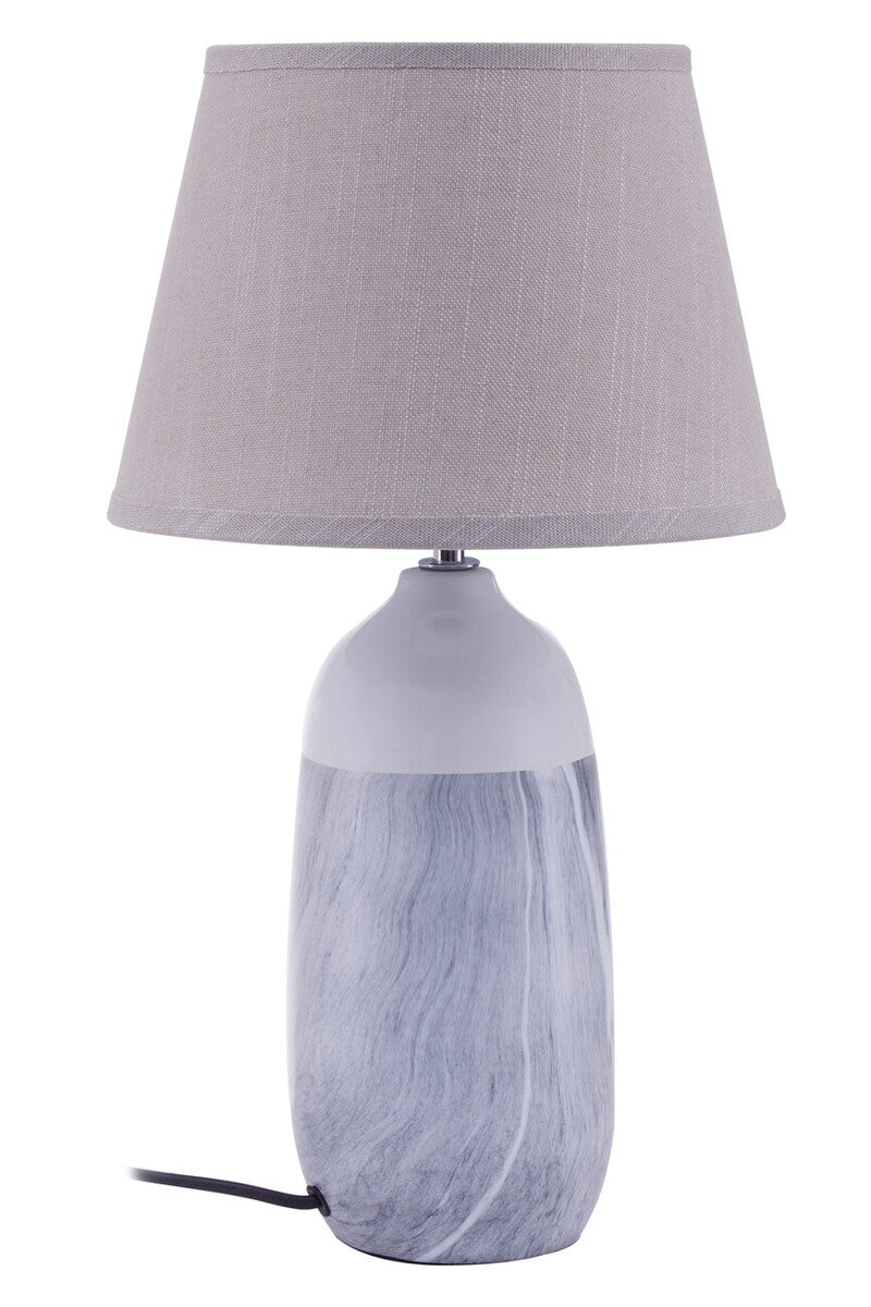 Table lamp with a gray fabric shade and marbled gray base on a white background