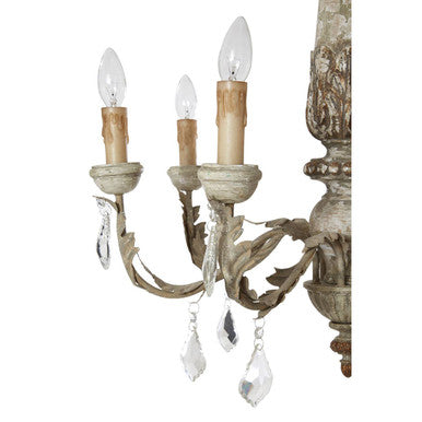 Decorative chandelier with three candle-style lights and crystal accents on a white background