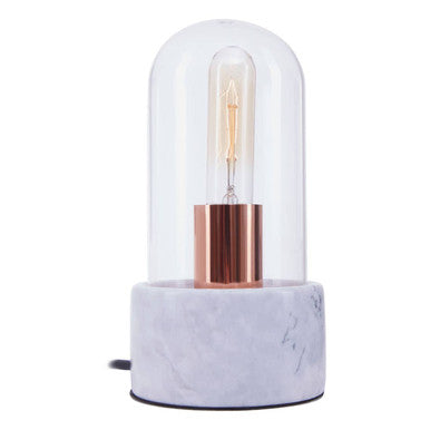 Table lamp with glass shade and marble base on a white background