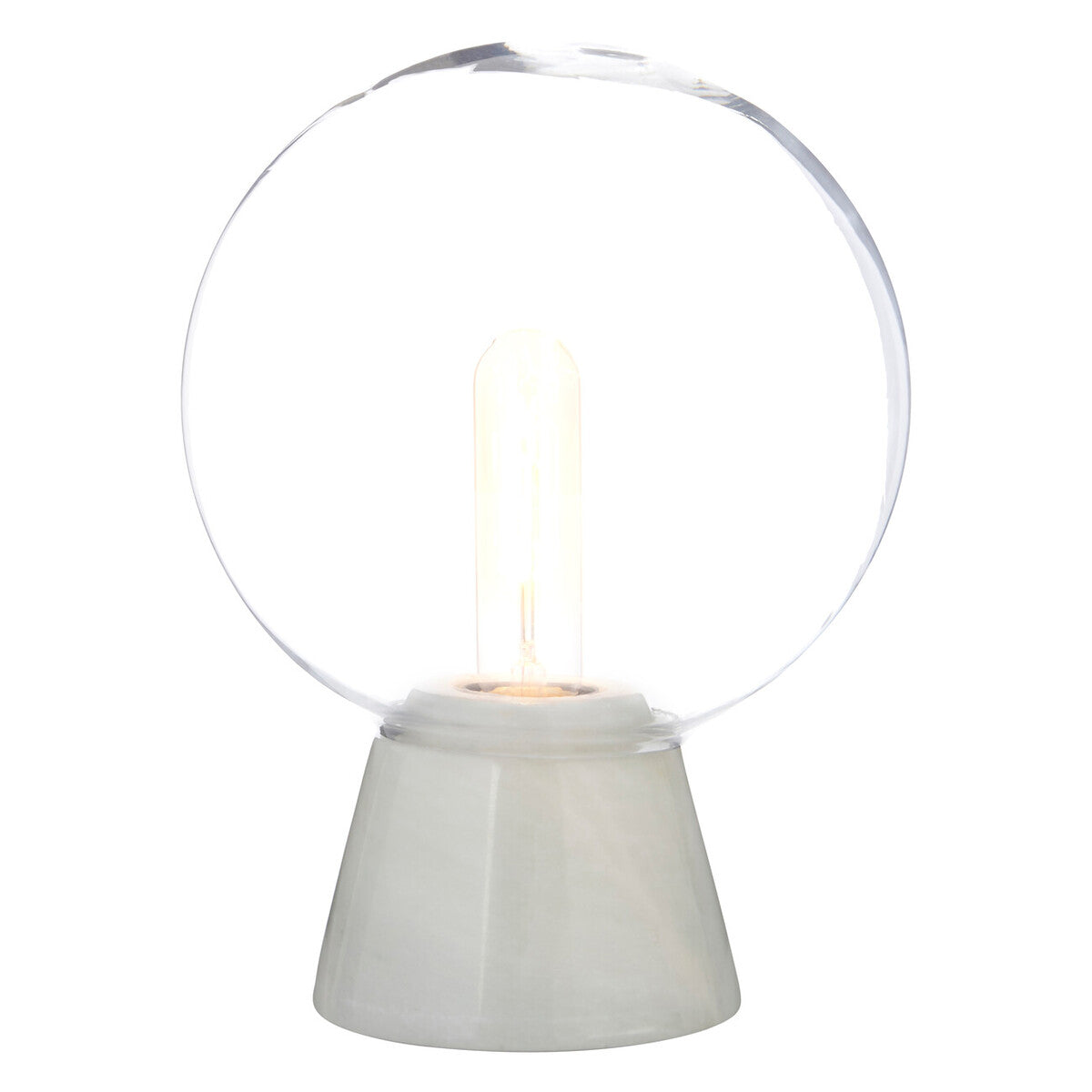 Modern table lamp with a clear glass shade and white base on a white background