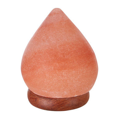 Himalayan salt lamp with wooden base on a white background