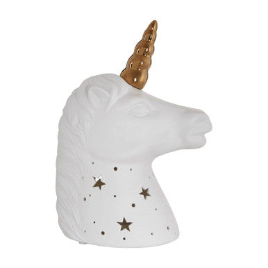 Unicorn-shaped candle holder with gold horn and star patterns on a white background