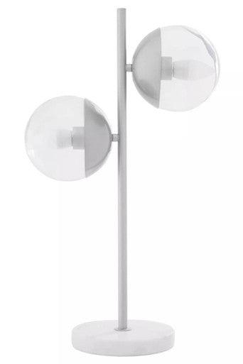 Modern floor lamp with three spherical shades on a white background