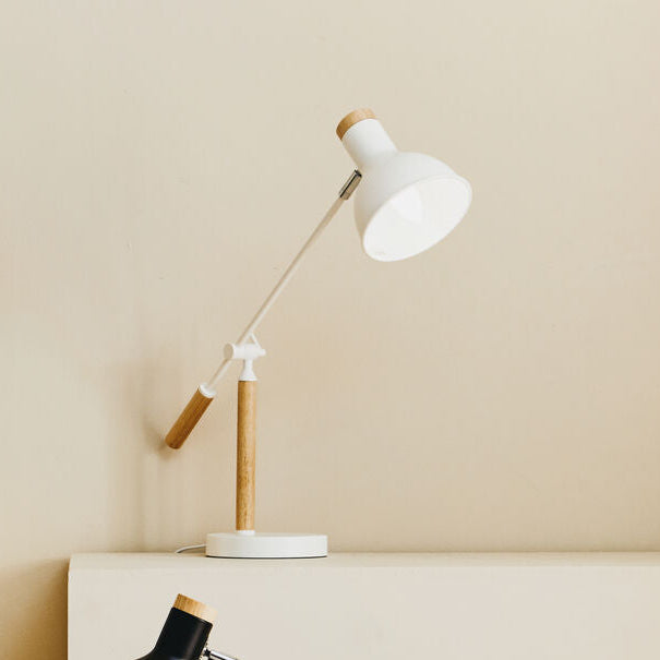 Three desk lamps on a neutral background
