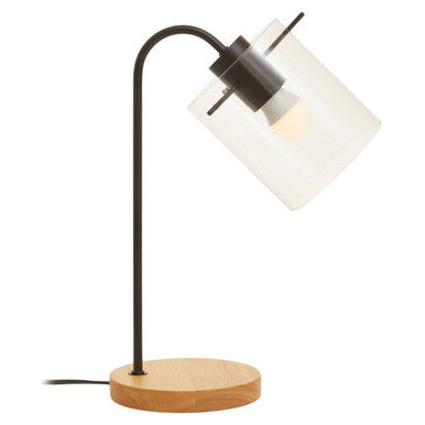 Table lamp with wooden base and white glass shade on a white background