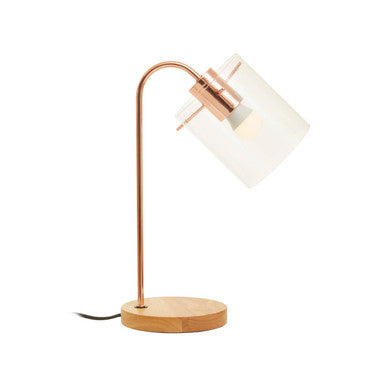 Table lamp with copper finish and white shade on a white background