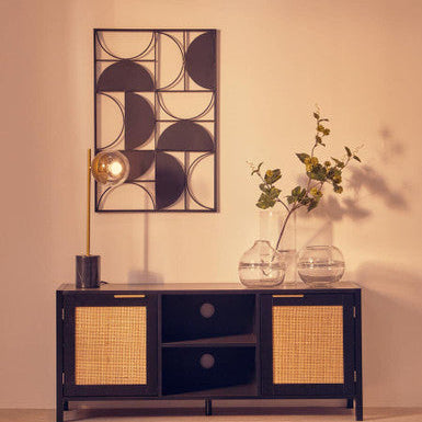 Modern sideboard with decorative mirror and vases in a room with geometric rug.