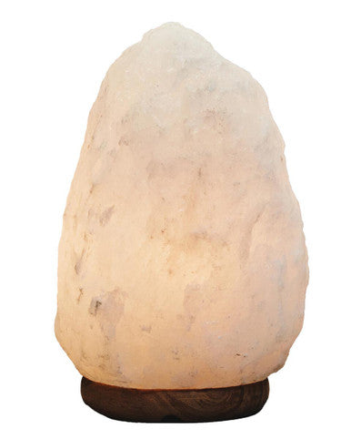 Rock-shaped lamp with wooden base on a white background