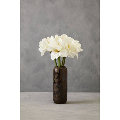 White flowers in a brown vase against a gray background
