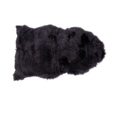 Black fur rug on a white background
