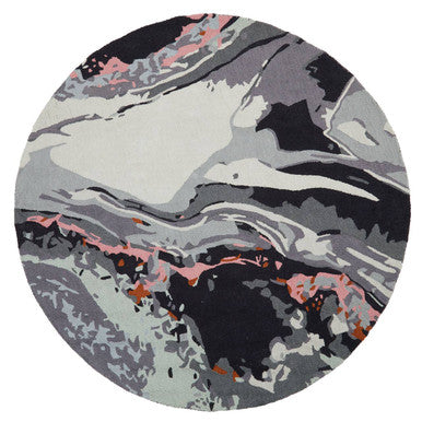 Round rug with abstract design in gray, black, and pink on a white background