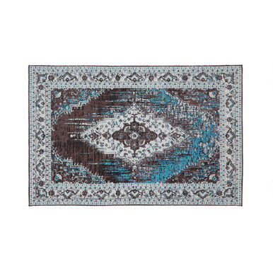 Decorative area rug with a geometric pattern on a white background