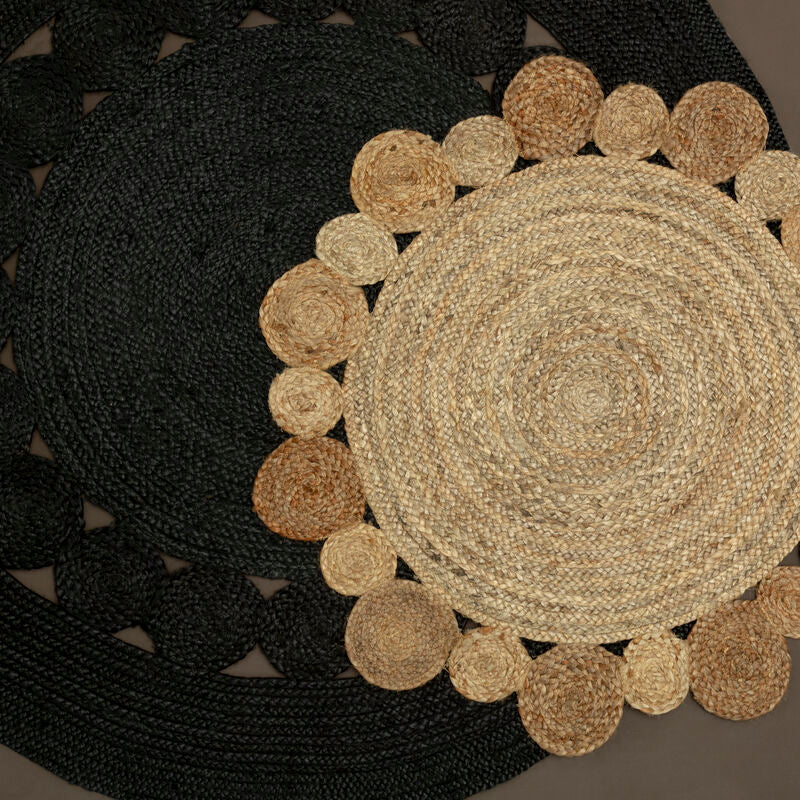 Round woven mat with a textured pattern on a dark surface