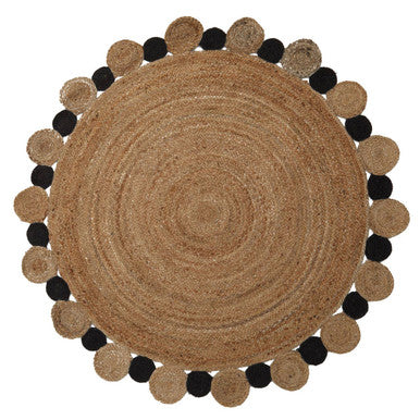 Round woven mat with black and beige circular patterns on a white background
