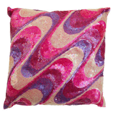 Decorative pillow with pink and purple abstract pattern on a beige background