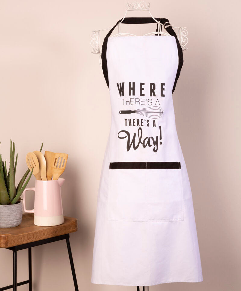 White apron with text hanging on a stand in a kitchen setting