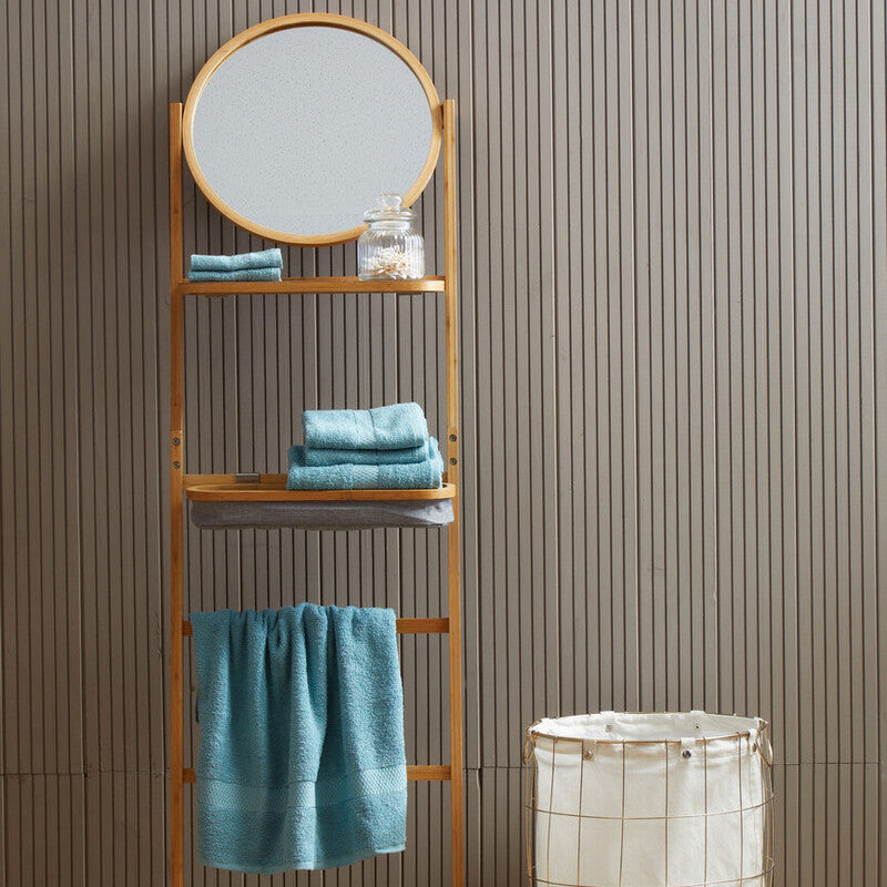 Towel rack with mirror and blue towels against a striped wall.