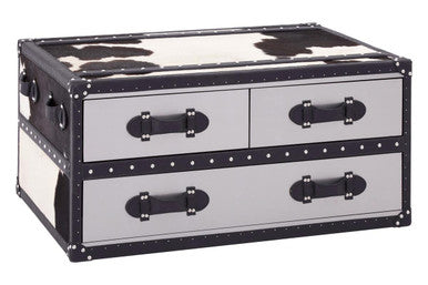 Black and white cowhide patterned chest with metal handles on a white background