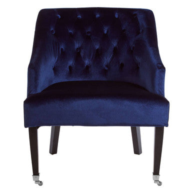 Navy blue velvet chair with tufted backrest on a white background