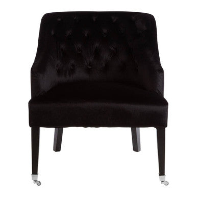 Black tufted chair on a white background