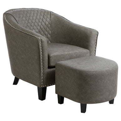 Gray upholstered armchair with matching ottoman on a white background