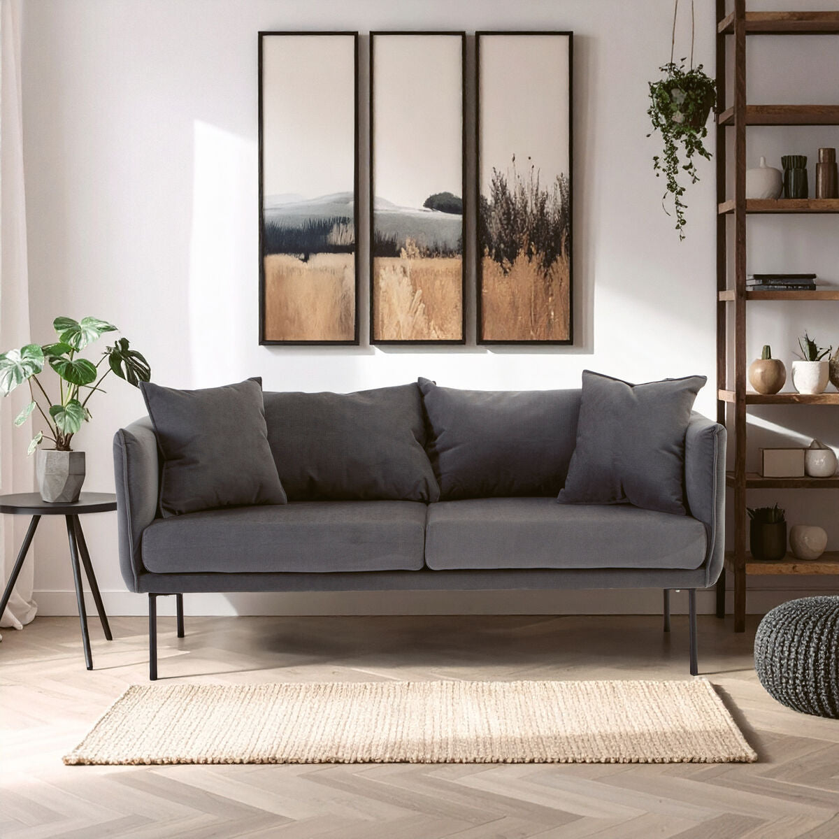 Gray sofa in a living room with wall art and decor