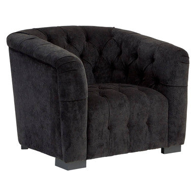 Dark gray tufted armchair on a white background