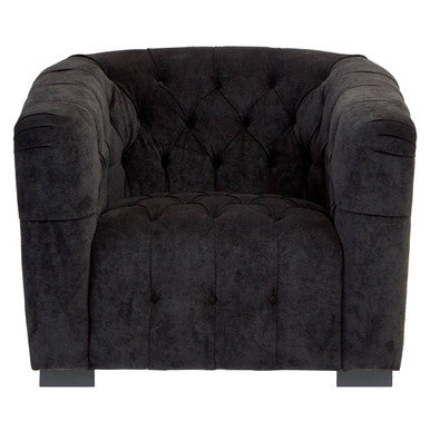 Dark gray tufted armchair on a white background